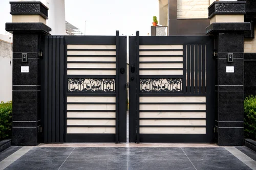Professional enamel painting on a decorative metal driveway gate in Coimbatore